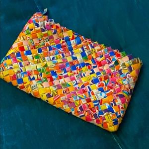 Wrapper woven clutch with zipper.